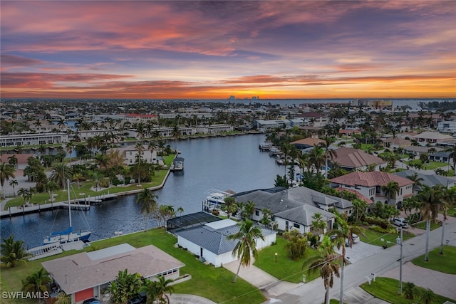 aerial view at dusk with a water view