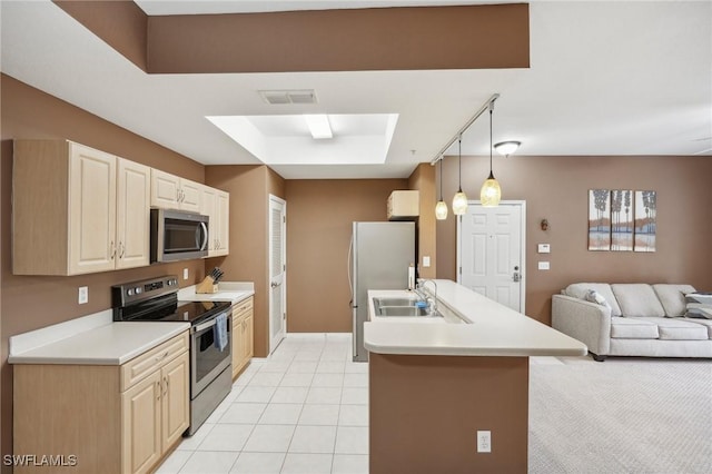 kitchen featuring a raised ceiling, light countertops, visible vents, appliances with stainless steel finishes, and open floor plan