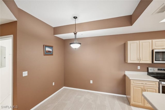 kitchen featuring visible vents, baseboards, light colored carpet, appliances with stainless steel finishes, and light countertops