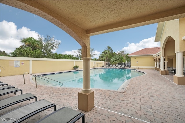 view of swimming pool with a patio