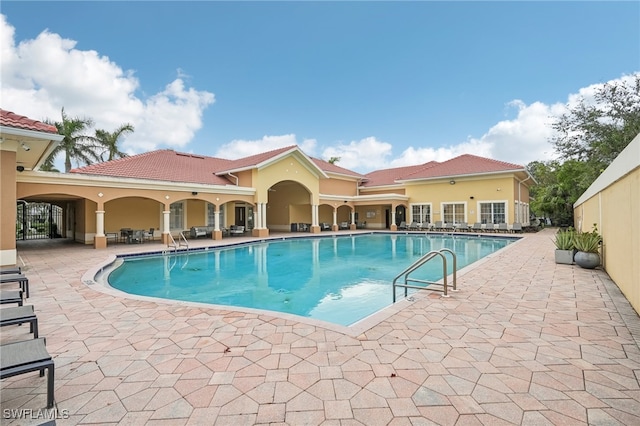 view of swimming pool featuring a patio area