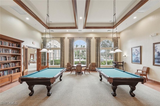 game room with a towering ceiling, ornamental molding, and pool table