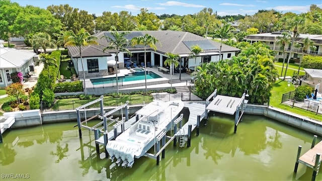 dock area featuring a patio area and a water view