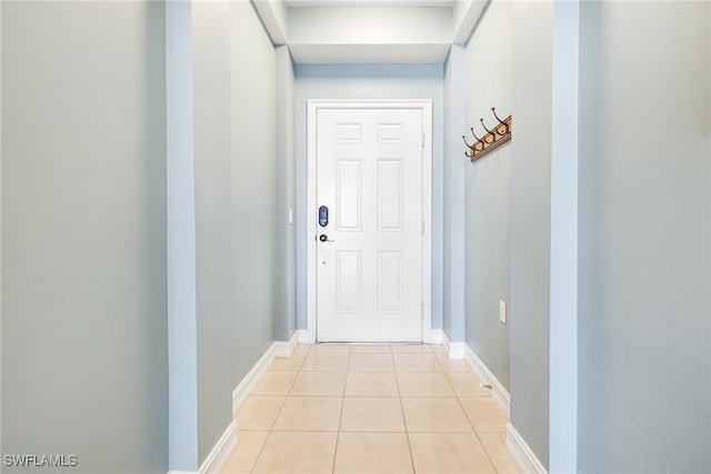 entryway with light tile patterned floors