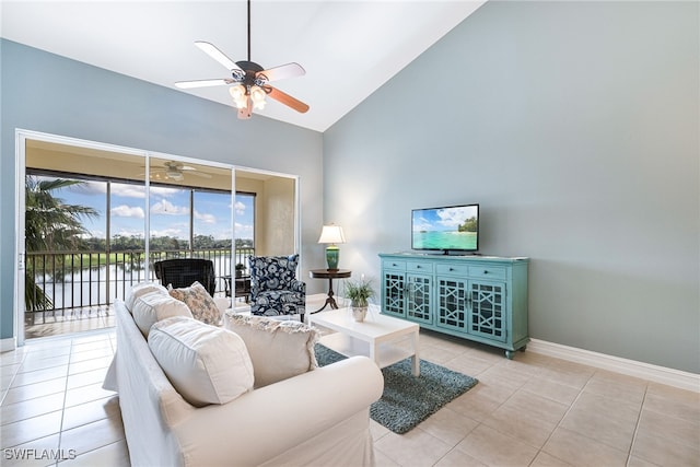 tiled living room featuring a water view, high vaulted ceiling, and ceiling fan