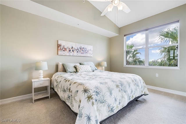 carpeted bedroom featuring ceiling fan and lofted ceiling