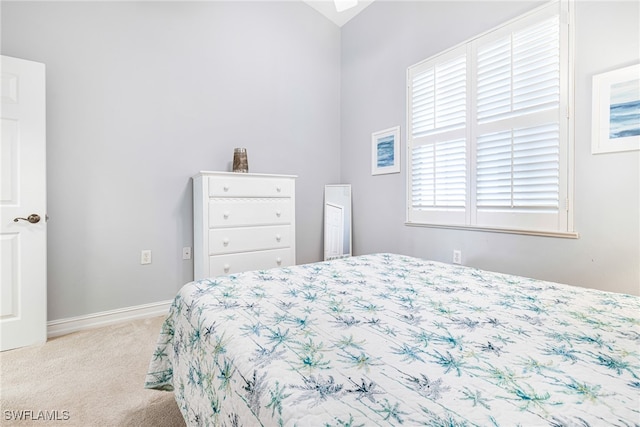 bedroom with light colored carpet