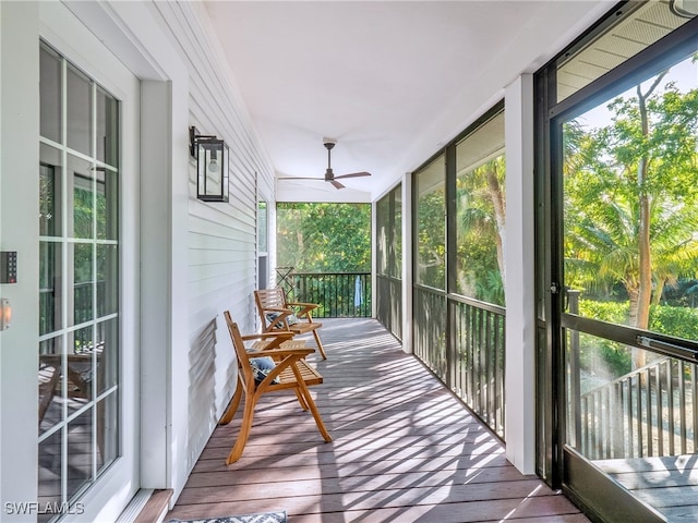 sunroom / solarium with ceiling fan