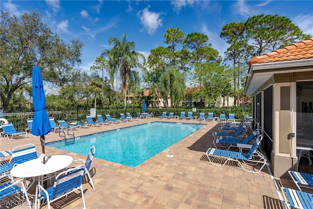 view of swimming pool with a patio area