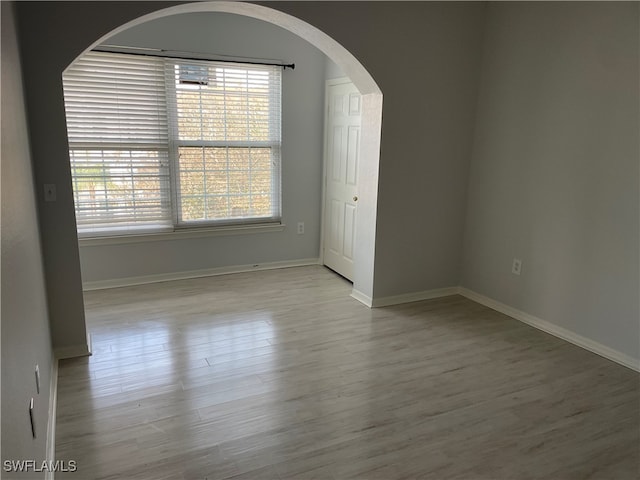 spare room featuring light hardwood / wood-style floors