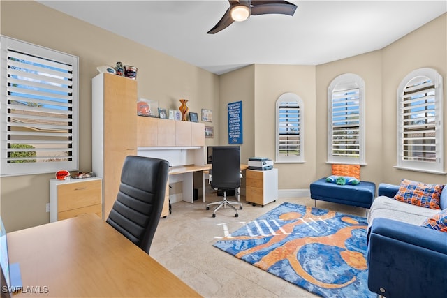 office space with ceiling fan and plenty of natural light