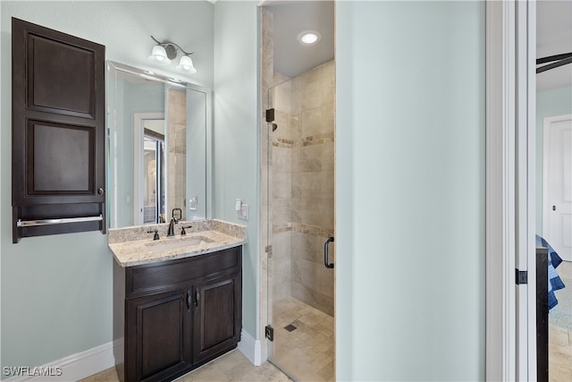 bathroom featuring vanity, tile patterned floors, and walk in shower