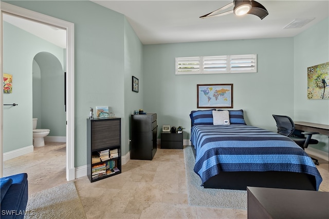 bedroom featuring connected bathroom and ceiling fan