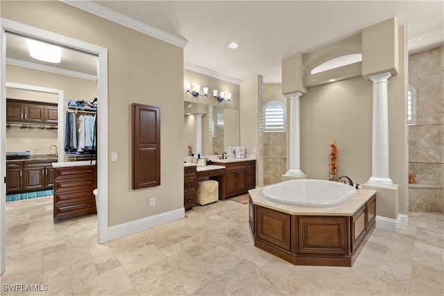 bathroom featuring a tub, vanity, and ornamental molding