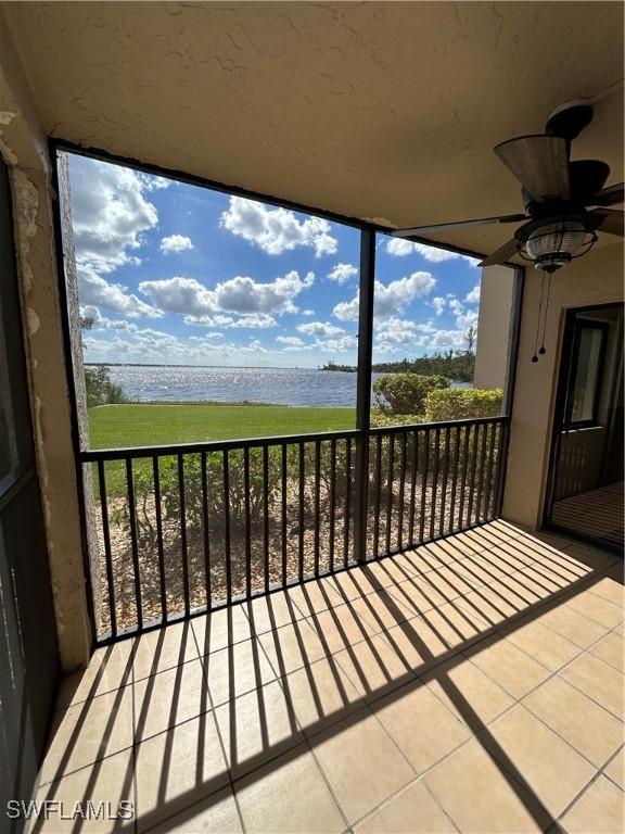 4510 N Key Dr Unit 105, North Fort Myers, FL 33903 - balcony featuring a water view and a ceiling fan