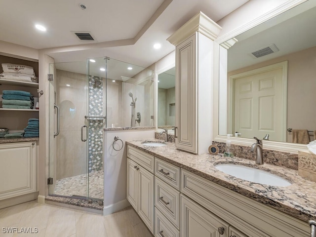 bathroom with vanity, tile patterned floors, and an enclosed shower