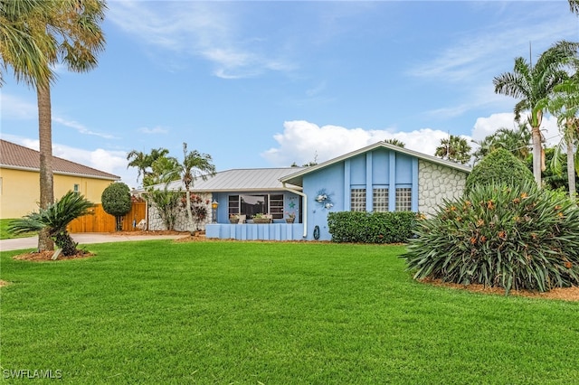 ranch-style house with a front yard