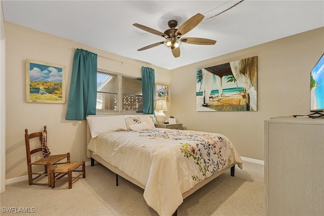 bedroom featuring light colored carpet and ceiling fan