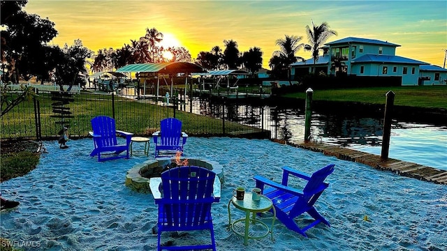 1857 Whitecap Cir, North Fort Myers, FL 33903 - dock area with a water view and a fire pit