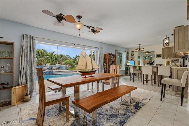 dining area with ceiling fan and light tile patterned floors