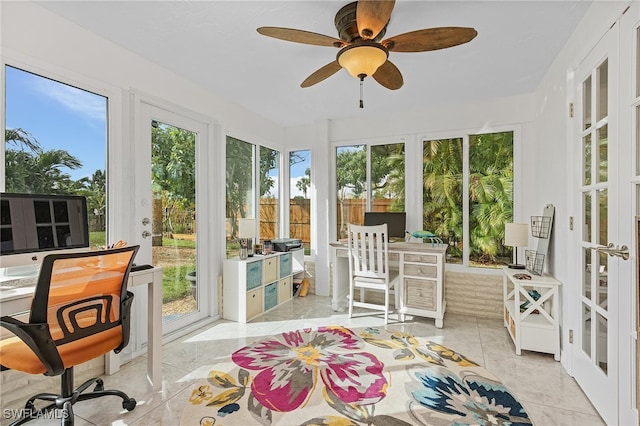 sunroom featuring french doors and ceiling fan