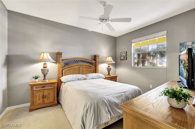 bedroom with light carpet and ceiling fan