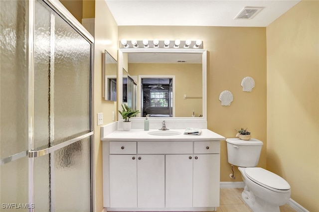 bathroom with walk in shower, tile patterned flooring, vanity, and toilet