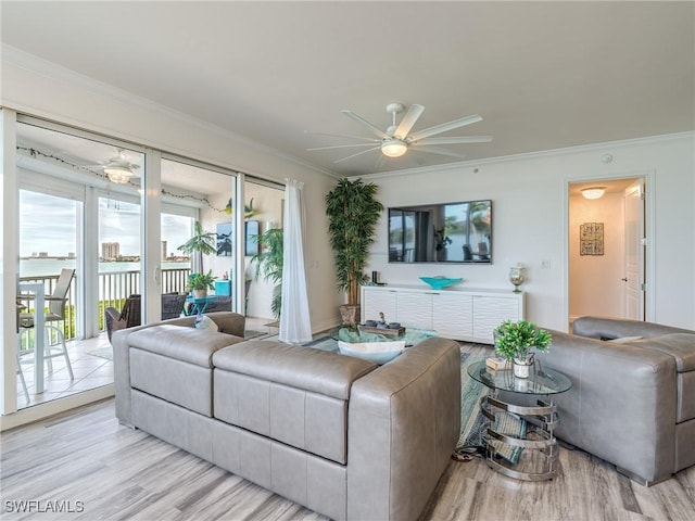 4137 Bay Beach Ln Unit 532, Fort Myers Beach, FL 33931 - living room featuring ceiling fan, wood finished floors, and ornamental molding