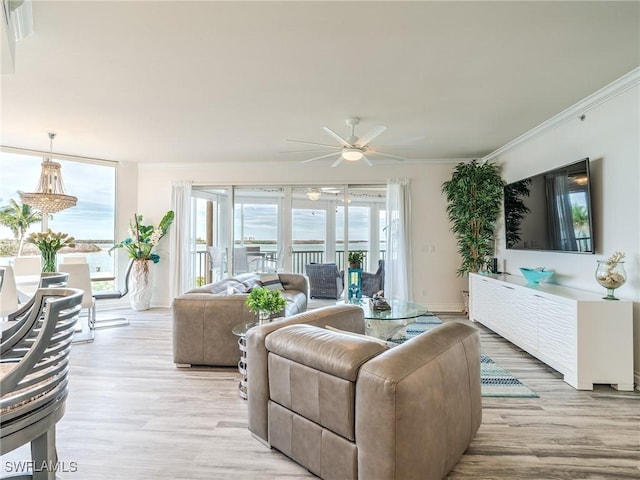 4137 Bay Beach Ln Unit 532, Fort Myers Beach, FL 33931 - living room with a ceiling fan, ornamental molding, and light wood finished floors