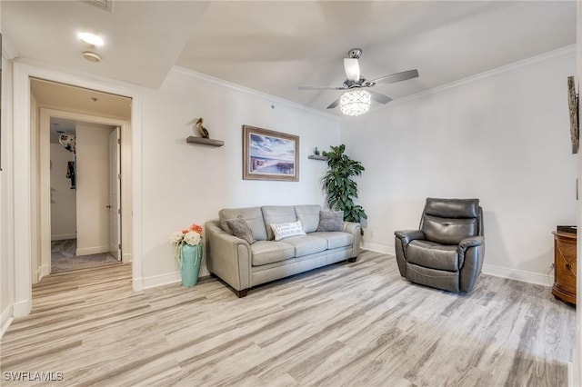 4137 Bay Beach Ln Unit 532, Fort Myers Beach, FL 33931 - living area featuring light wood-style floors, ceiling fan, baseboards, and ornamental molding