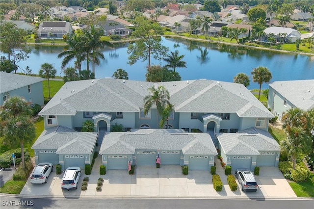 birds eye view of property with a water view