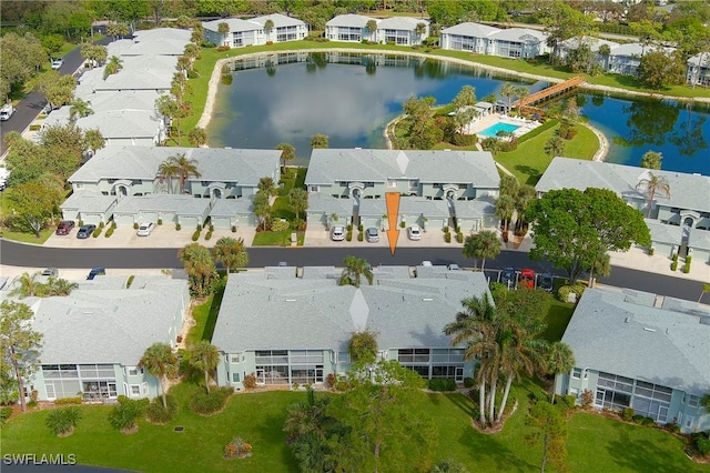 birds eye view of property featuring a water view