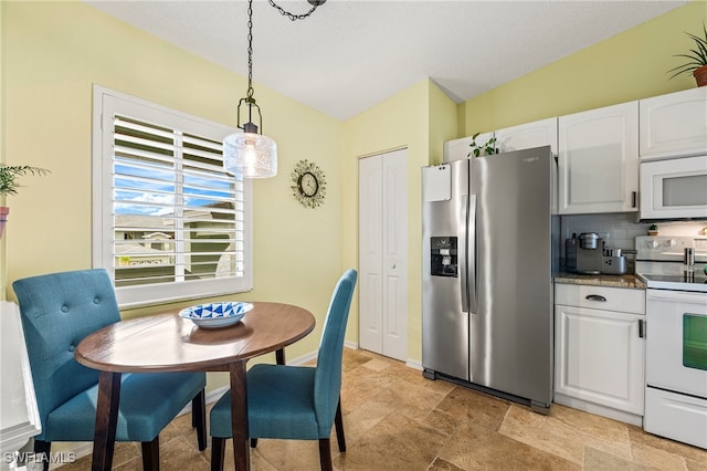 kitchen with decorative backsplash, white appliances, a textured ceiling, pendant lighting, and white cabinets