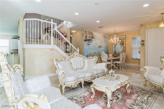 living room featuring an inviting chandelier