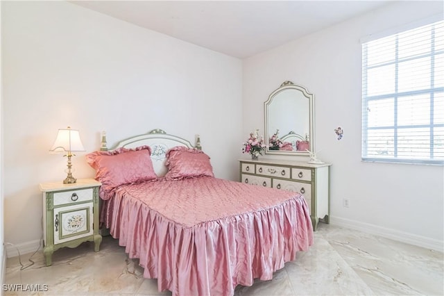 bedroom featuring multiple windows