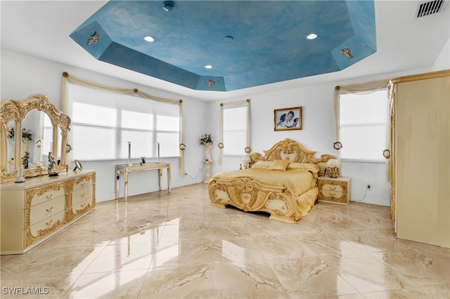 bedroom with a tray ceiling