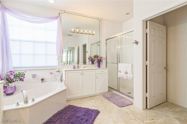 bathroom featuring vanity and plus walk in shower