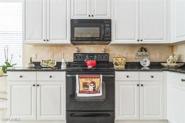 kitchen featuring white cabinetry, dark stone countertops, and black appliances