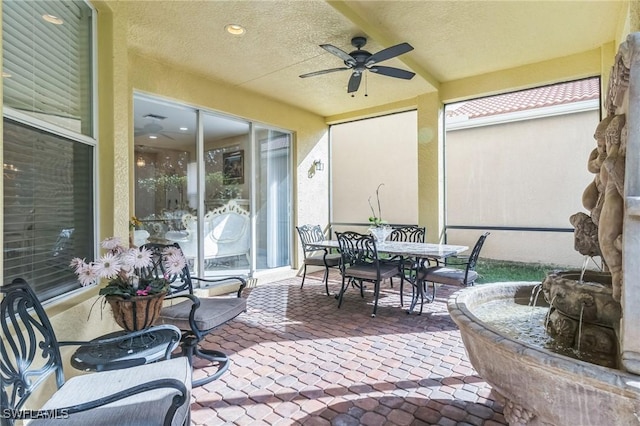 view of patio / terrace featuring ceiling fan