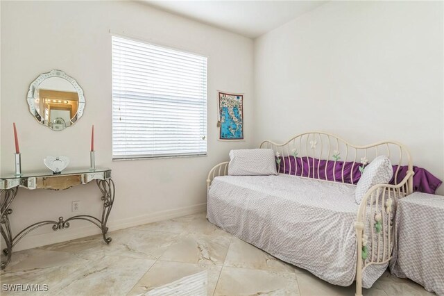 bedroom with multiple windows