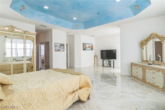 bedroom with a raised ceiling