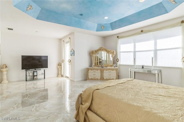 bedroom featuring a raised ceiling