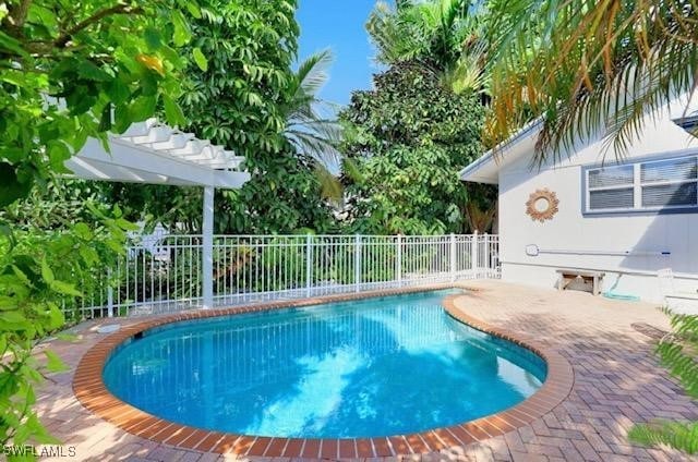 view of swimming pool with a pergola and a patio