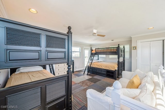 bedroom featuring ceiling fan, a closet, and ornamental molding