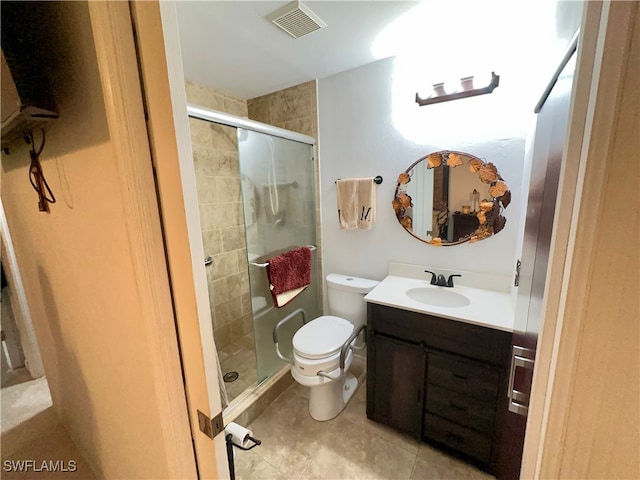 bathroom with vanity, toilet, and an enclosed shower