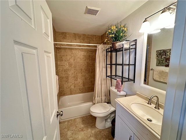 full bathroom featuring toilet, vanity, shower / bath combo with shower curtain, and tile patterned flooring