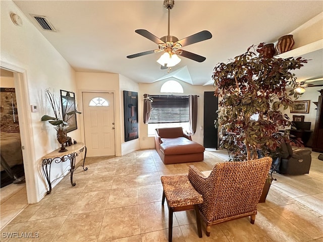 interior space featuring lofted ceiling and ceiling fan