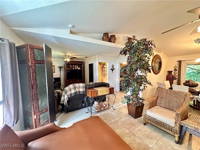 living room with vaulted ceiling, light tile patterned floors, and ceiling fan