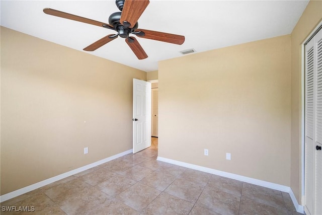 unfurnished bedroom with a closet and ceiling fan