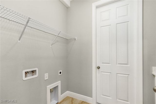 washroom with washer hookup, electric dryer hookup, and light wood-type flooring